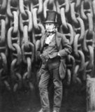 Isambard Kingdom Brunel, FRS (9 April 1806 – 15 September 1859), was a leading British civil engineer, famed for his bridges and dockyards, and especially for the construction of the first major British railway, the Great Western Railway; a series of famous steamships, including the first propeller-driven transatlantic steamship; and numerous important bridges and tunnels. His designs revolutionised public transport and modern engineering.<br/><br/>

Though Brunel's projects were not always successful, they often contained innovative solutions to long-standing engineering problems. During his short career, Brunel achieved many engineering 'firsts', including assisting in the building of the first tunnel under a navigable river and the development of the SS Great Britain, the first propeller-driven ocean-going iron ship, which was at the time (1843) also the largest ship ever built.