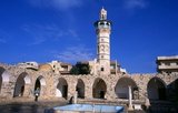 The Great Mosque was first built by the Umayyads in the 8th century CE and was modelled on the Umayyad Mosque in Damascus. It was almost completely destroyed in 1982 during the Sunni muslim uprising in Hama.<br/><br/>

Hama is the location of the historical city of Hamath. In 1982 it was the scene of the worst massacre in modern Arab history. President Hafaz al-Assad ordered his brother Rifaat al-Assad to quell a Sunni Islamist revolt in the city. An estimated 25,000 to 30,000 people were massacred.